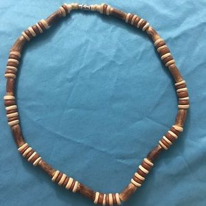 Made of wooden material. Necklace/choker